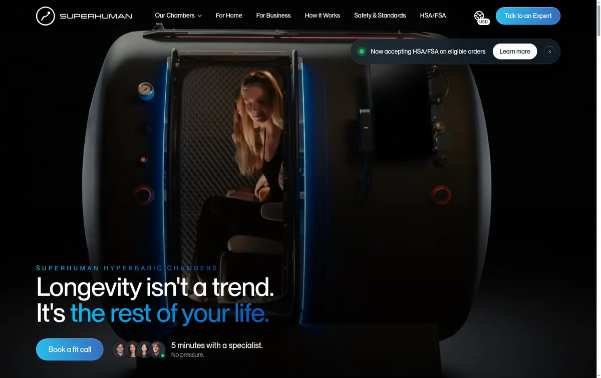 Superhuman homepage with a woman seated inside a dark hard-shell chamber and the headline Longevity isn’t a trend